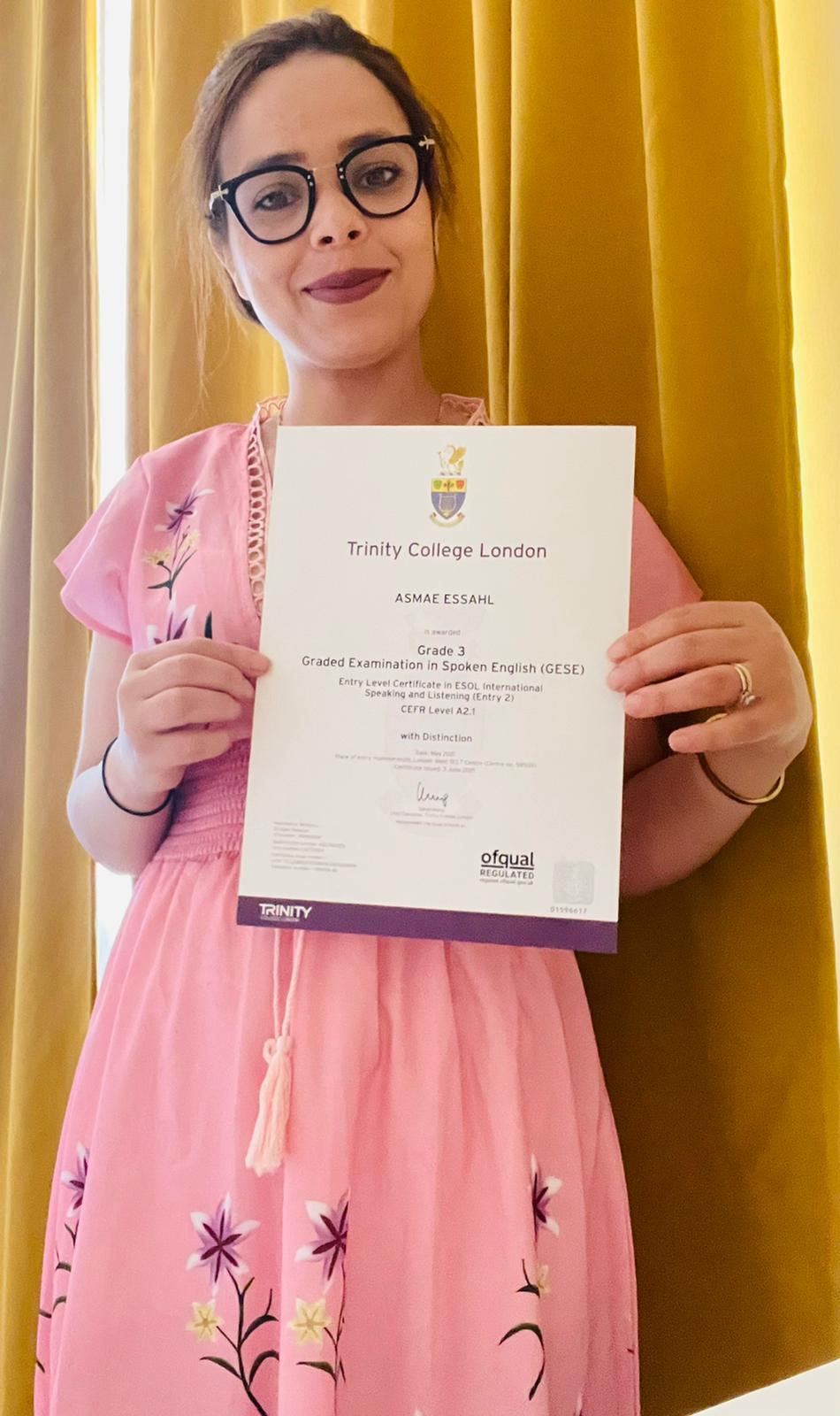 Successful student with her Trinity College London certificate after studying at Focus English.